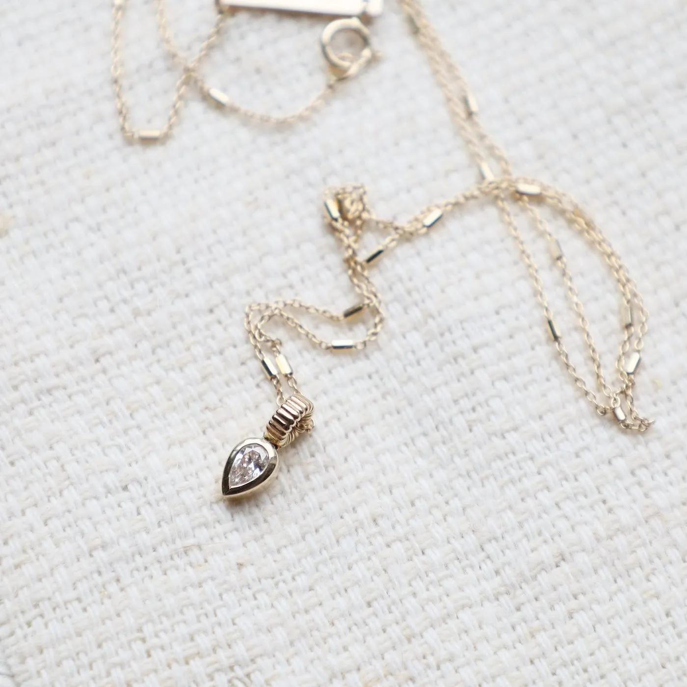 14k Bezel Set Pear Diamond Necklace with Corrugated Bead Bail