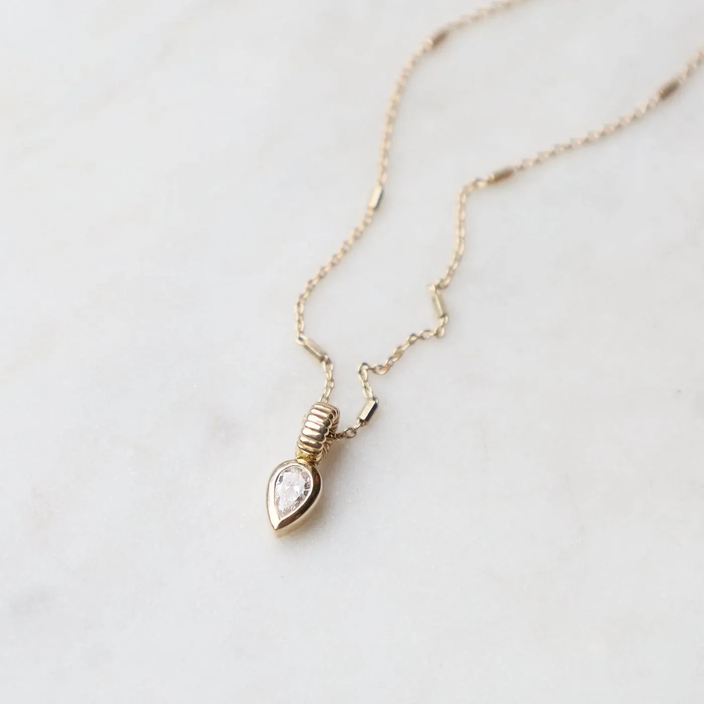 14k Bezel Set Pear Diamond Necklace with Corrugated Bead Bail