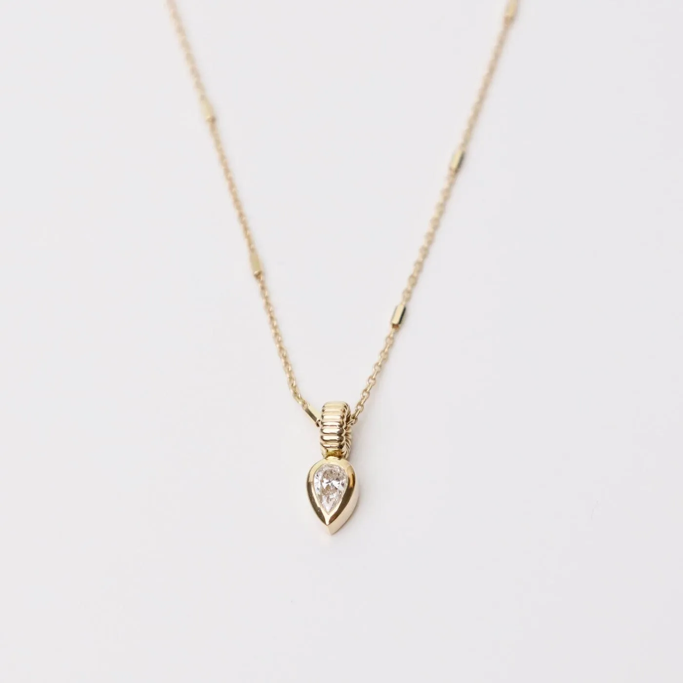 14k Bezel Set Pear Diamond Necklace with Corrugated Bead Bail
