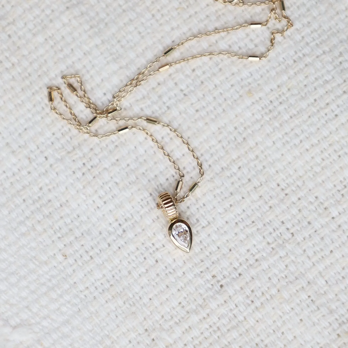 14k Bezel Set Pear Diamond Necklace with Corrugated Bead Bail